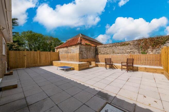 Rear paved seating area