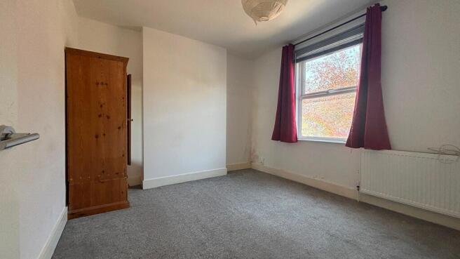 Bright airy bedroom with natural light and spac...
