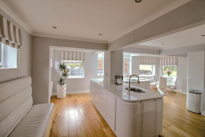 Kitchen and banquette seating area