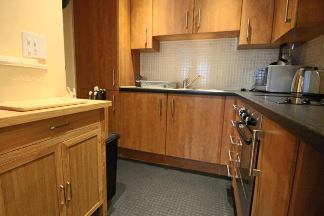 Kitchen area open plan to the lounge