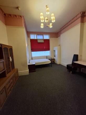 Grand bedroom with period features and ample sp...