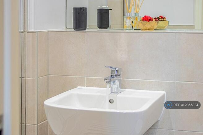 Modern Bathroom With Fresh Towels, Soap, Shampoo