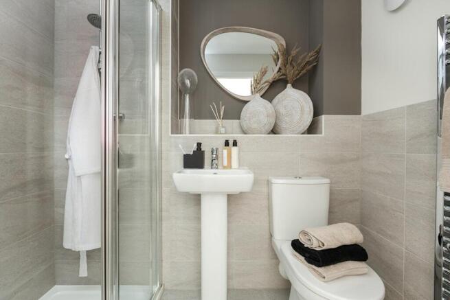 The main bedroom has its own en-suite shower room