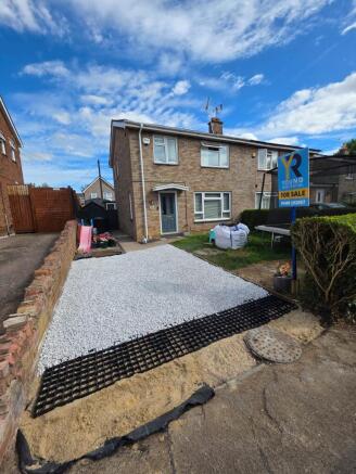 Front with new driveway
