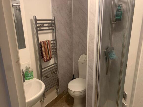 Modern bathroom with sleek heated towel rail....