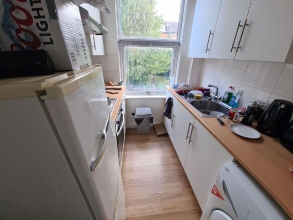 A bright and tidy kitchen with ample counter sp...
