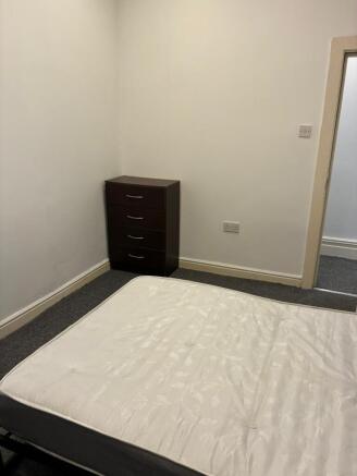 Bright and tidy room with ample storage space f...