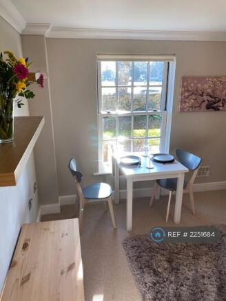Living Room With Dining Area By The Window