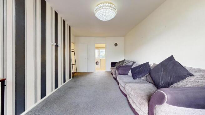 Bright living area with plush sofas...