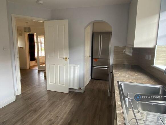 Kitchen With View Of Utility And Hallway
