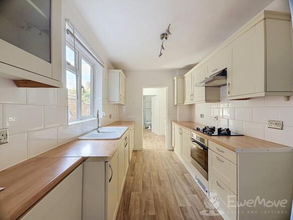 Cream kitchen with wood effect worktops