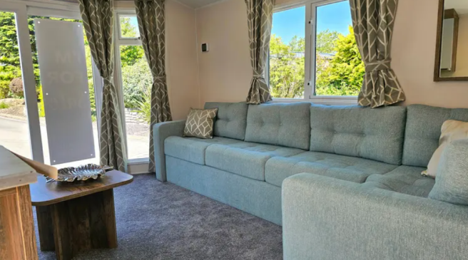 Bright Lounge With Large Corner Sofa And Patio Doo
