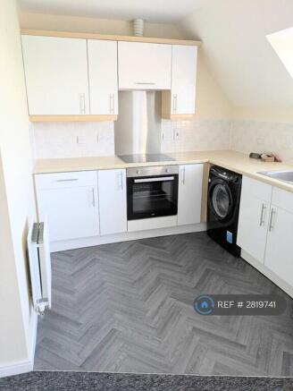Kitchen With New Flooring And Cupboard Doors
