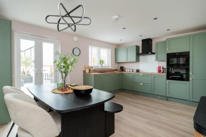 French doors open to the garden from the kitchen/dining area