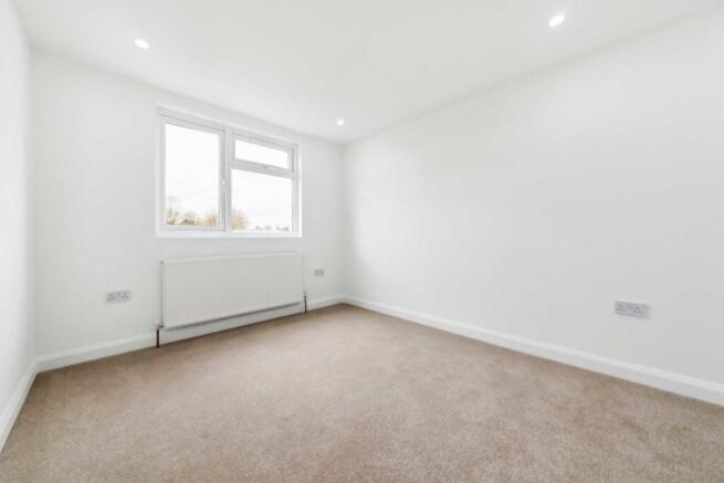 Bright, clean bedroom with fresh neutral decor...