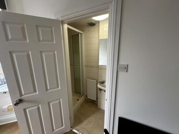 Compact bathroom with separate shower and clean...