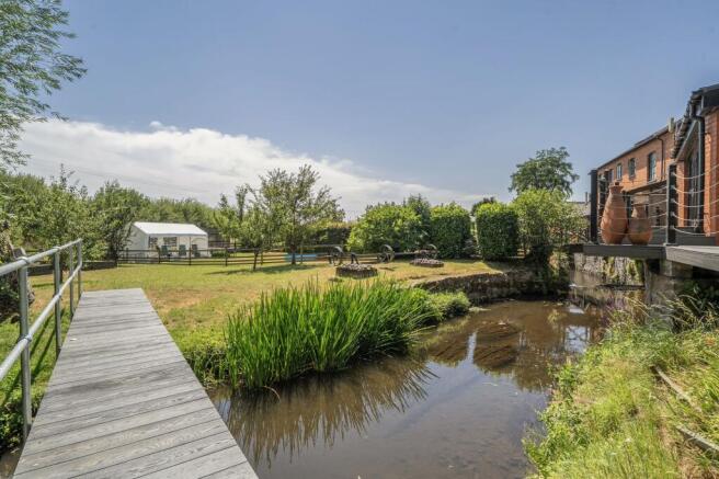 Rear garden with bridge