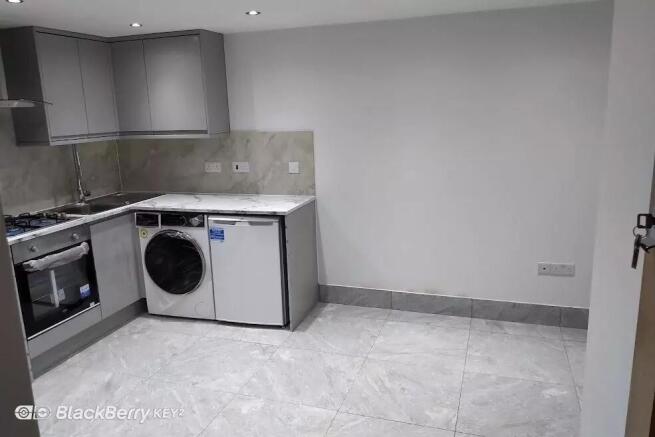 Modern fitted kitchen with stylish grey units...