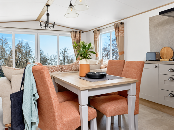 Bright Open Plan Dining Area With Upholstered Chai