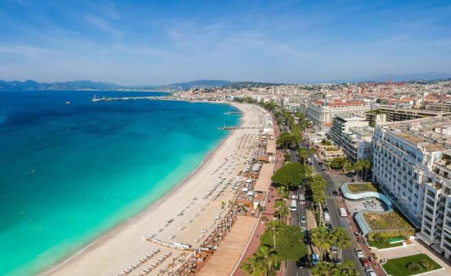 Panorama of Cannes, Cote d'Azur, France, South Europe. Nice city and luxury resort of French riviera. Famous tourist destination with nice beach and Promenade de la Croisette on Mediterranean sea