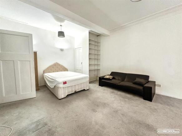 Spacious room with double bed and cozy sofa...