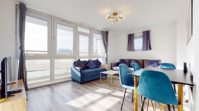 Bright living room with huge windows and sofa...