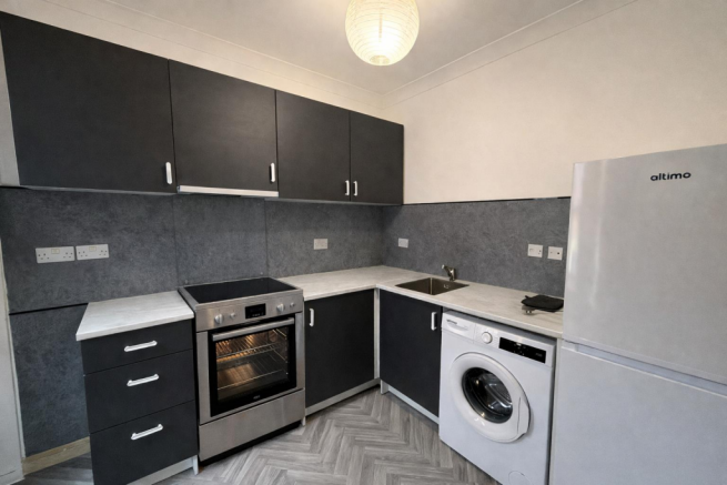 Modern L-shaped kitchen setup (1).png