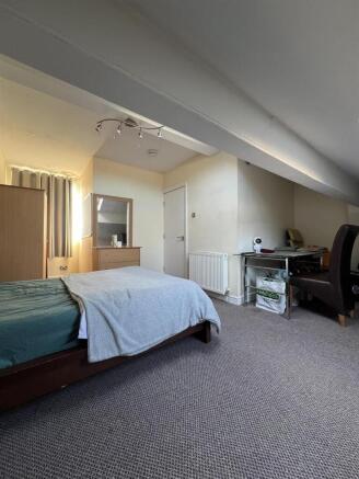 Bright, spacious bedroom with dedicated desk ar...