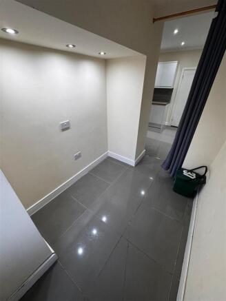 Bright modern hallway with sleek tiled flooring...