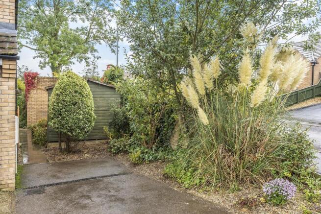 Parking and space to side of property