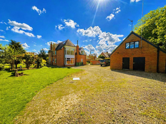 Sunny countryside home with greenery.png