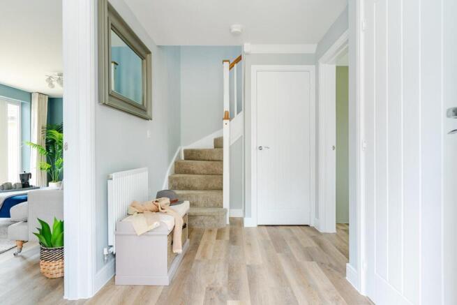 The welcoming entrance hallway is a light and airy space within the spacious Trusdale