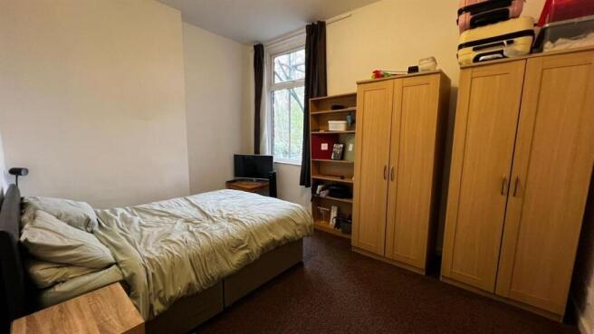 Bright double bedroom with ample storage space...
