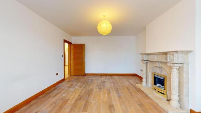 Bright living room with feature fireplace...