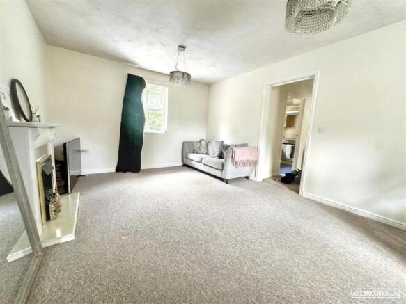 Bright and spacious lounge with comfy seating...
