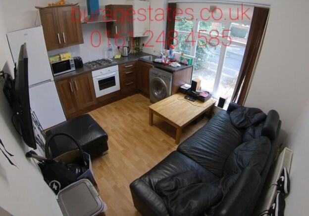 Well-presented open-plan living area with a com...