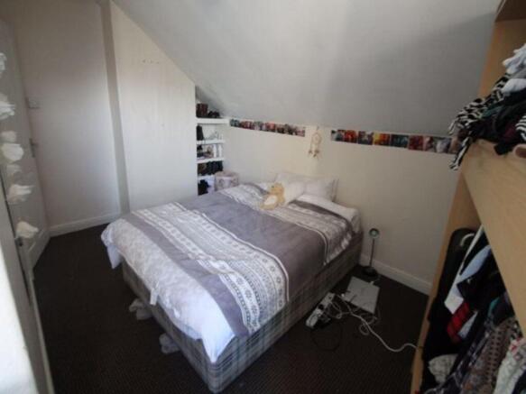 A spacious master bedroom featuring a large dou...