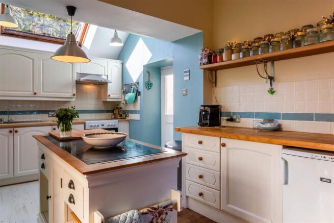 Kitchen showing rear door