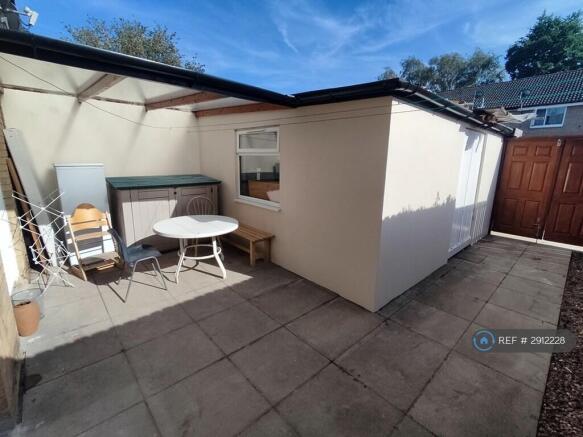 Back Garden With Storage Outbuilding