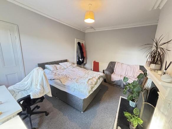 A spacious and well-maintained master bedroom f...