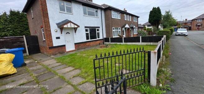 Semi with gated front lawn and driveway...