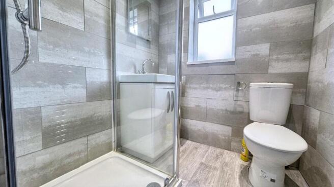 Modern tiled bathroom with sleek walk-in shower...