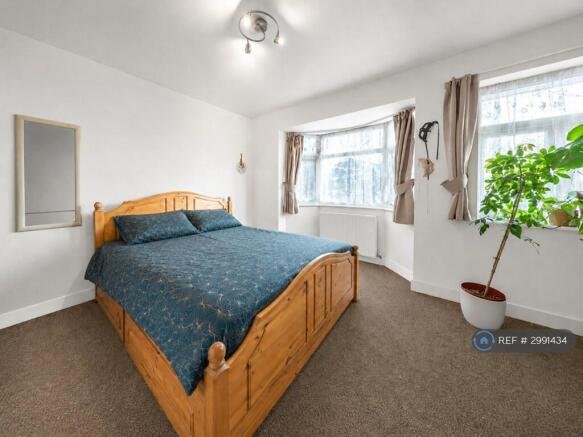 Generous Principal Bedroom With Bay Windows