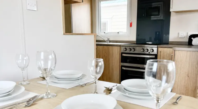 Abi Trieste Dining Area And Fitted Kitchen In Whit