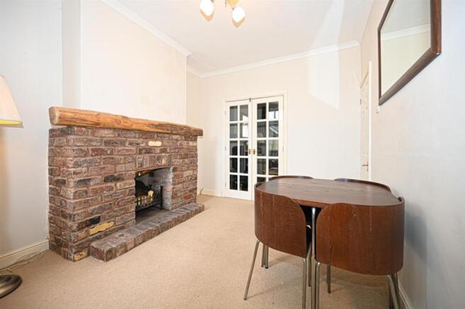 Reception/dining room with under stairs cupboard