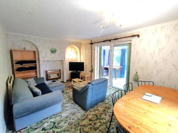 Bright, comfortable living room with seating ar...