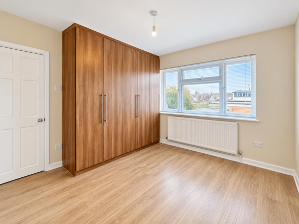 Modern Empty Bedroom with Built-In Wardrobe.png