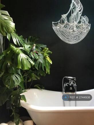 Family Bathroom With Large  Roll Top Bathtub 