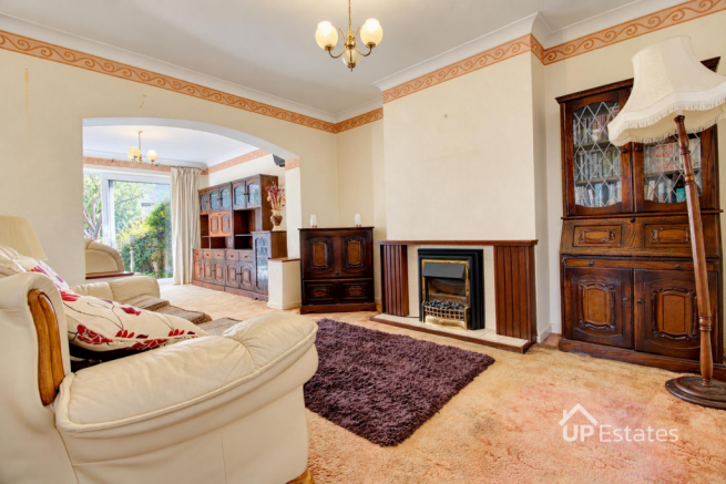 Cream-walled living room, naturally lit-3.png