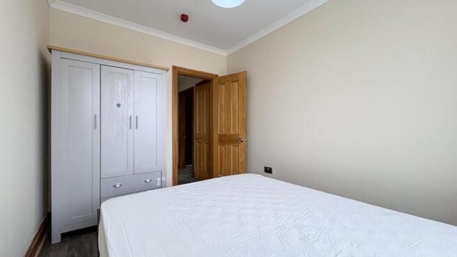 Bright bedroom with sleek modern wardrobe...